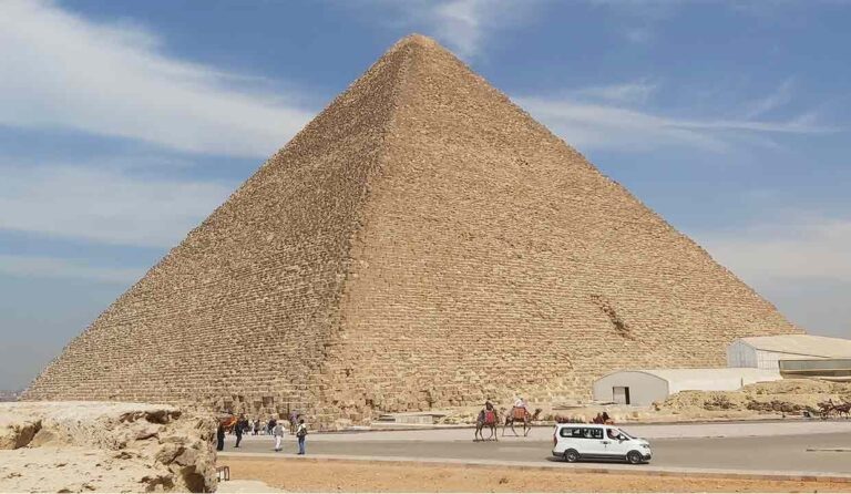 The Khufu Pyramid, also known as the Great Pyramid of Giza, a massive ancient stone pyramid with a square base and four triangular faces.