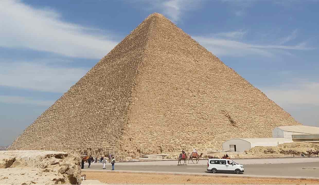 The Khufu Pyramid, also known as the Great Pyramid of Giza, a massive ancient stone pyramid with a square base and four triangular faces.