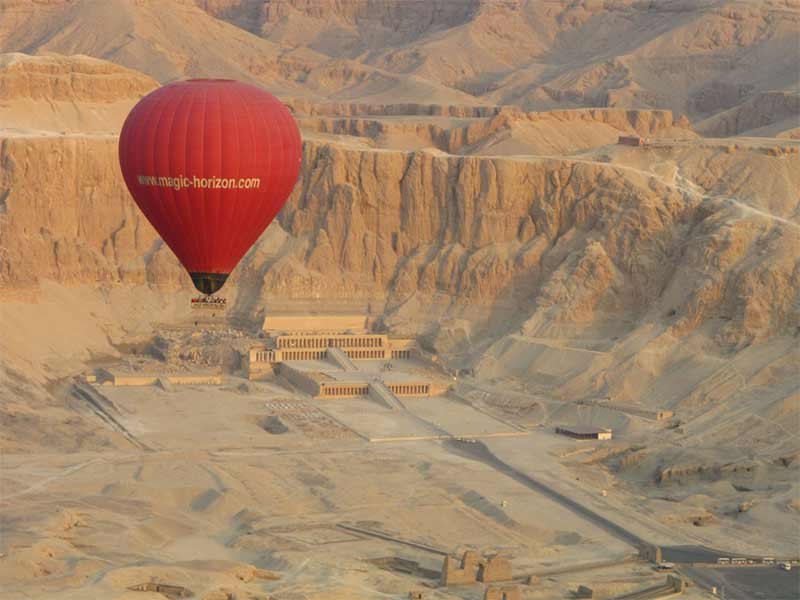 Hot air balloon flying over Queen Hatshepsut Temple in Luxor